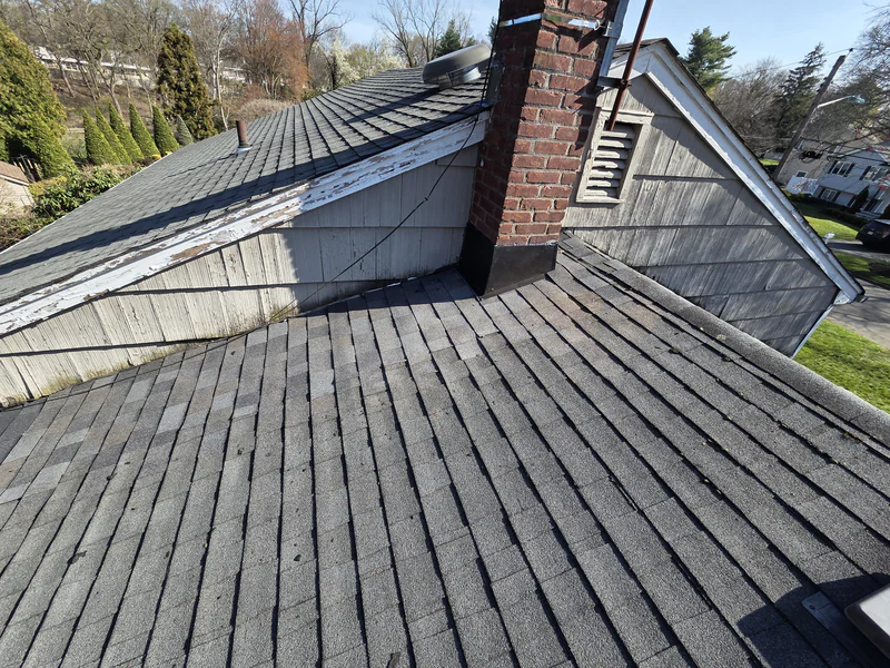 After the repair: new metal flashing where the chimney meets the roof